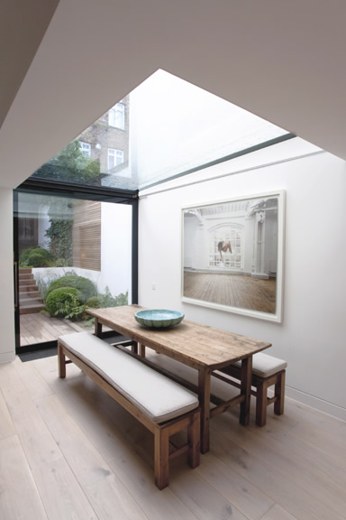 The playfulness in choosing the photograph in the space does not minimise the quality of its proposal but enhances and somehow upgrade the informality of the furniture. Photography courtesy of Orde Eliason, photographer.