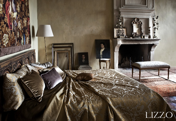 The informal sophistication of this bedroom is enhanced by the use of luxurious fabrics. The mixture of classic patterns and solid colours brings a modern look to the composition. The blanket determines the look of the bedroom regardless the use of earthy materials in it. Fabric big pillows and blanket: Besarabia C/05; Fabric cushions: Murano C/06, C/22 and C/19 and Venus C/11. Aberdeen collection by Lizzo. Photography courtesy of Lizzo.