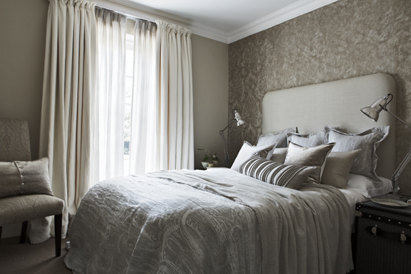 Would you say this bed is irresistible? Comfortable?. I would say here is beauty in its slightly careless arrangement. The plane headboard and the bed linen are part of the scheme given to the room, chromatically speaking. The final effect is a peaceful and cohesive proposal. The soft fabric of the blanket, the beautiful throw and the cushions were made specifically. Bespoke is always the ideal option when after a unique outcome. De Le Cuona fabrics: Blanket: samurai gull; throw: feather cashmere; Head board: cape twilight; Cushions from front to back: opera opal in Mali, pintuck design, liquid pewter, samurai gull and opera opal. Photography courtesy of De Le Cuona.