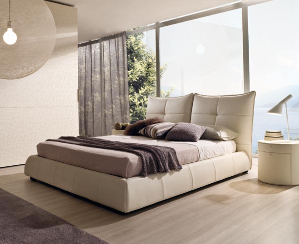 This is another contemporary solution where the bed as a whole unit works as a neutral background for displaying cushions/pillows in different fabrics and colours, a more playful attitude is the rule, however knowing when to stop this solution keep it elegant and correct. Ellelle bed from Falegnami. Photography courtesy of www.puntoit.co.uk.